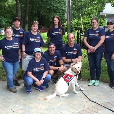 Members of LEAD, the disability-focused employee resource group at Boston Scientific, pose together at a community event promoting disability inclusion..