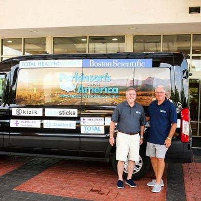 Jim Morgan (left) and Scott Rider with the Parkinson's Across America motorcoach